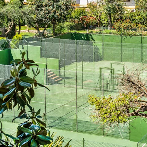 Practice your serve on the communal padel tennis courts