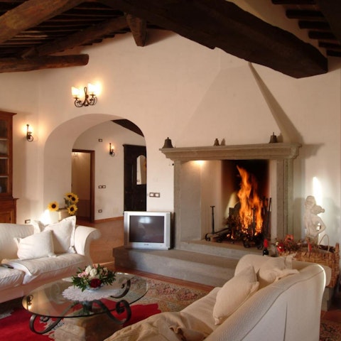 Snuggle up in front of the fire in the traditional living areas