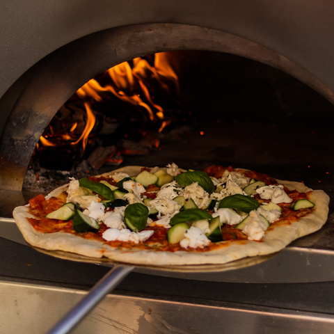 Enjoy homemade pizzas for dinner, made in the brick pizza oven