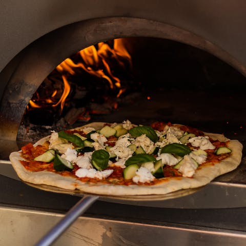 Enjoy homemade pizzas for dinner, made in the brick pizza oven