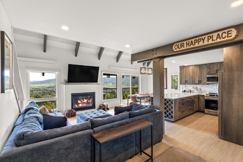 Sink into a deep sofa with the fire lit and peaks framed beyond