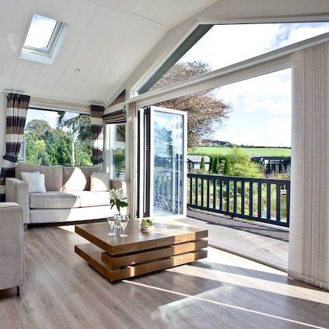Slide open the bi-fold doors to let the sunshine in