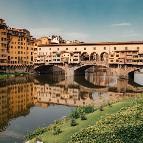 Time a sunset stroll along the nearby River Arno