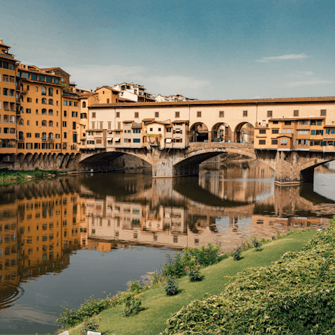 Time a sunset stroll along the nearby River Arno