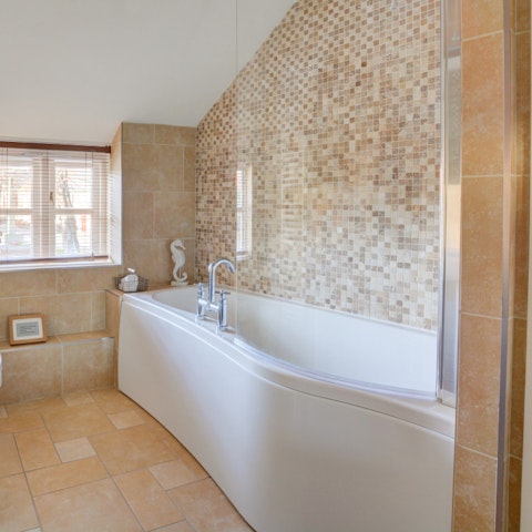 Enjoy a long bubbly soak after bracing coastal walks