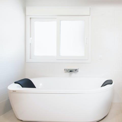 Treat yourself to an extra-long soak in the freestanding tub