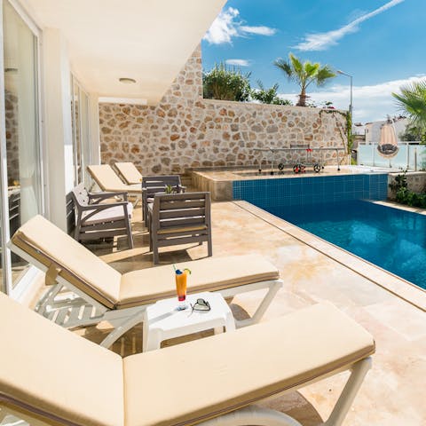 Sip a cocktail by your private pool