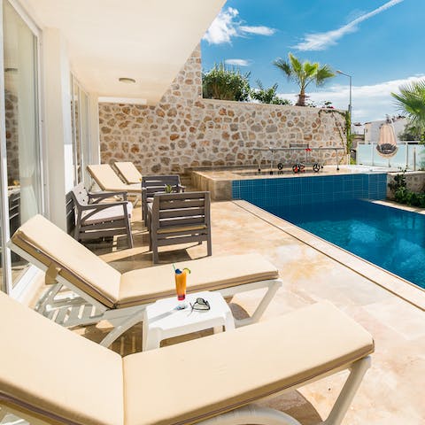 Sip a cocktail by your private pool