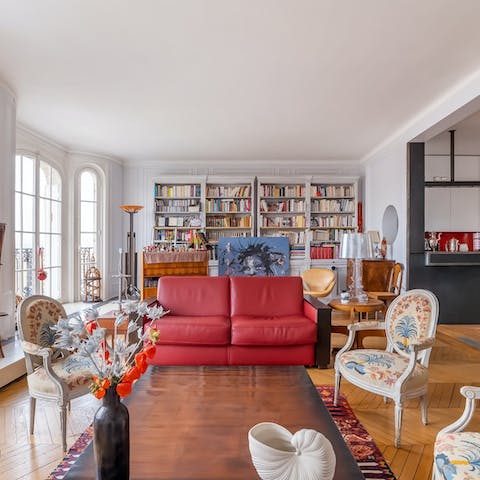 Relax in the elegant living room with one of the books on the shelves