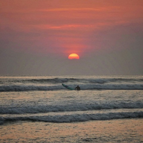 Go surfing at sunset on Seminyak Beach, only 500 metres away