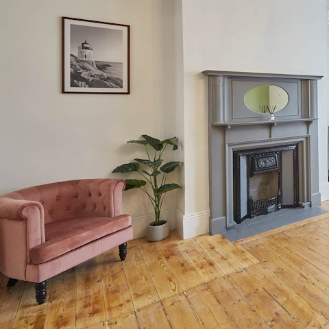 Curl up in the candy pink velvet armchair