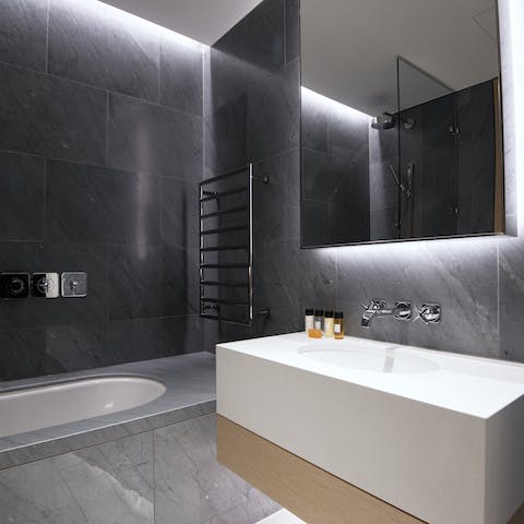 Enjoy a long soak in the marble bathtub after a day mooching around