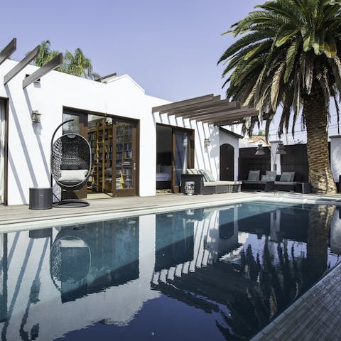 Relax with an ice cold drink in the hanging egg chair or before swimming a couple of lengths in the pool