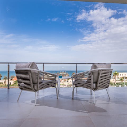 Head upstairs to your private balcony and enjoy a cool glass of wine on your bedroom's private balcony