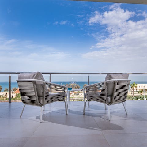 Head upstairs to your private balcony and enjoy a cool glass of wine on your bedroom's private balcony