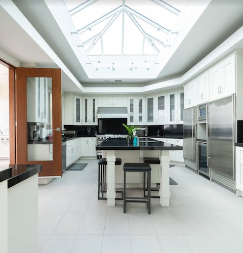 Cook in plenty of natural light, courtesy of the cathedral glass ceiling