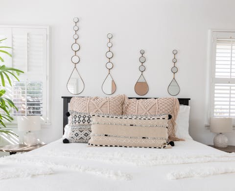 The teardrop mirrors in the master bedroom
