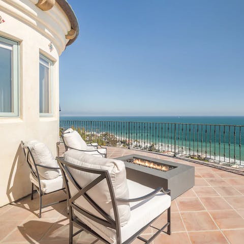 Chill out by the firepit, overlooking the endless Pacific Ocean