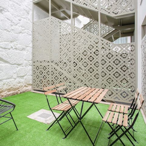 Catch a breath of fresh air on the enclosed balcony