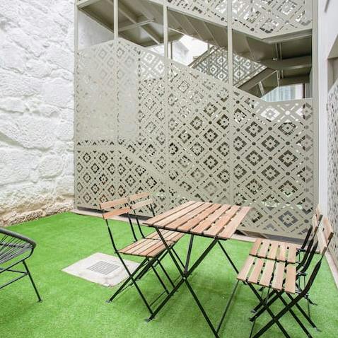 Catch a breath of fresh air on the enclosed balcony