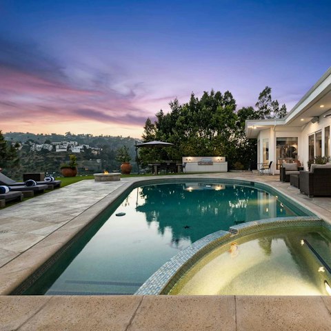 Swim as the sky turns pink over the Hollywood Hills