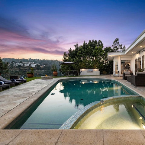 Swim as the sky turns pink over the Hollywood Hills