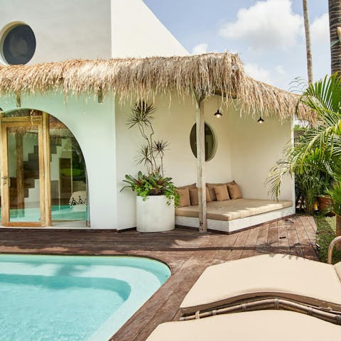 Find peace and relaxation while lounging by the pool