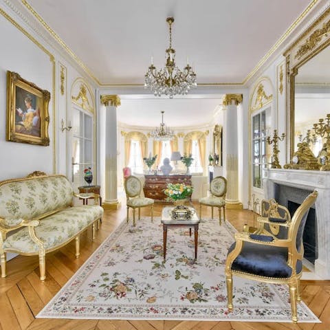 Have some Champagne in the living room with its Louis XVI style