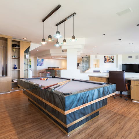 Challenge other guests to a game of pool on the sleek pool table