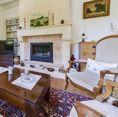Sink into armchairs by the fireside