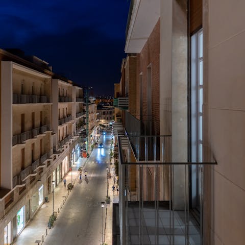 People-watch over a glass of Italian wine from the private balcony