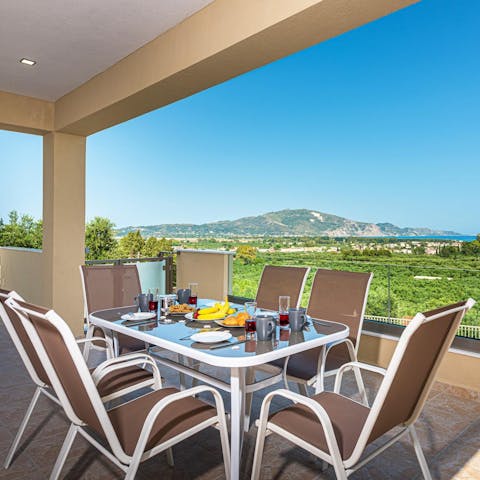 Enjoy alfresco meals overlooking the sparkling seascape