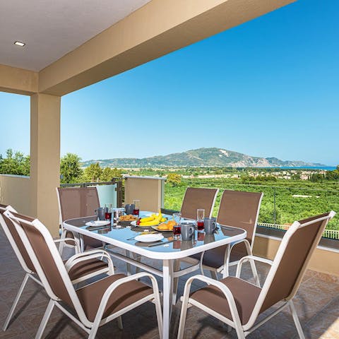 Enjoy alfresco meals overlooking the sparkling seascape