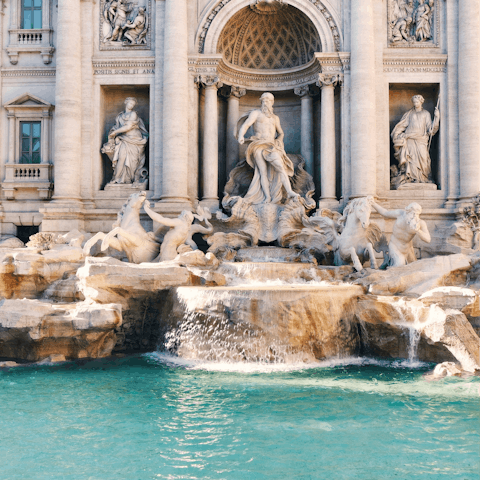 Cross the Ponte Sisto and walk thirty minutes to the Trevi Fountain