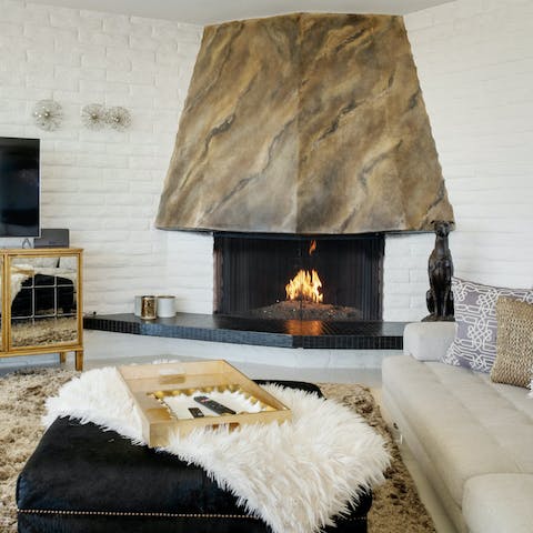 Gather around the fire with a glass of wine