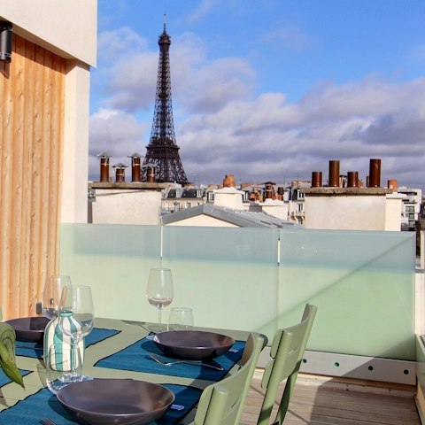 Enjoy views of the Eiffel Tower from the private terrace