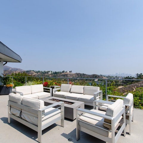 Gather the group together on the deck's alfresco seating and start the fire-pit up once the sun goes down