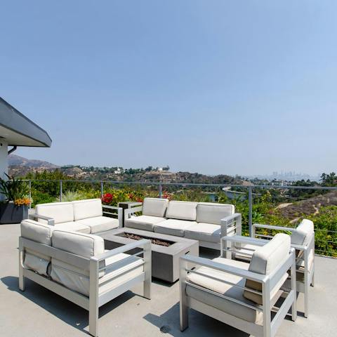 Gather the group together on the deck's alfresco seating and start the fire-pit up once the sun goes down