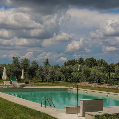 Let the day pass you by as you relax by the communal pool