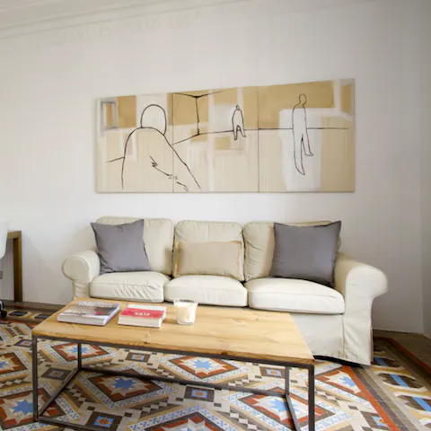 Relax on the plush sofa and watch TV after a long day of exploring the city