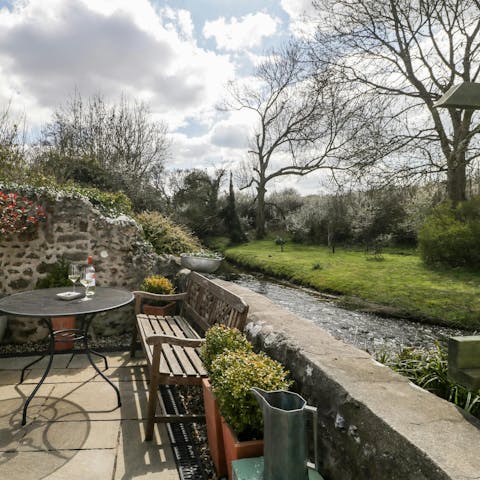 Admire the beautiful views over the River Frome from the private courtyard