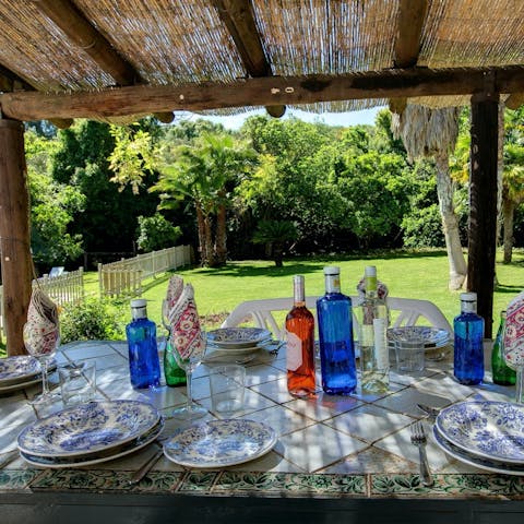 Sit down at the shaded dining table for alfresco tapas and wine