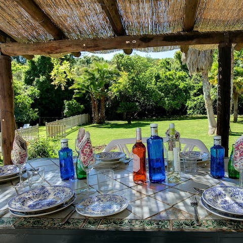 Sit down at the shaded dining table for alfresco tapas and wine