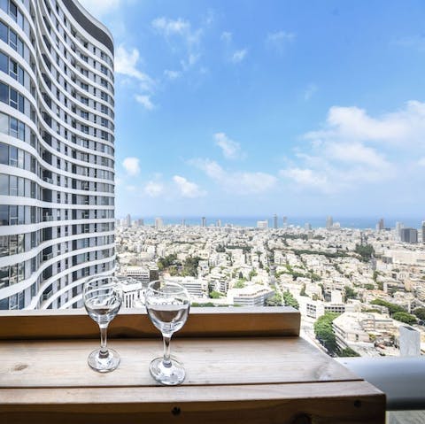 Admire the wonderful view of Tel Aviv's skyline from the 36th floor