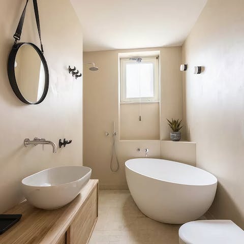 Treat yourself to a long soak in the freestanding tub after a day of exploring the city on foot