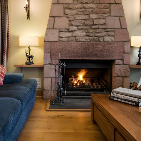 Have a glass of whisky by the open fire