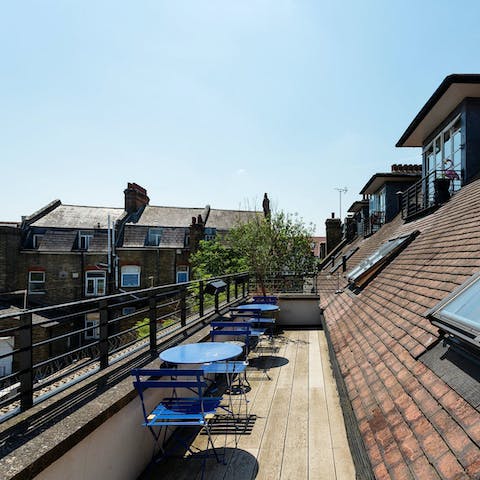 Step out onto the shared balcony and unwind with a beer