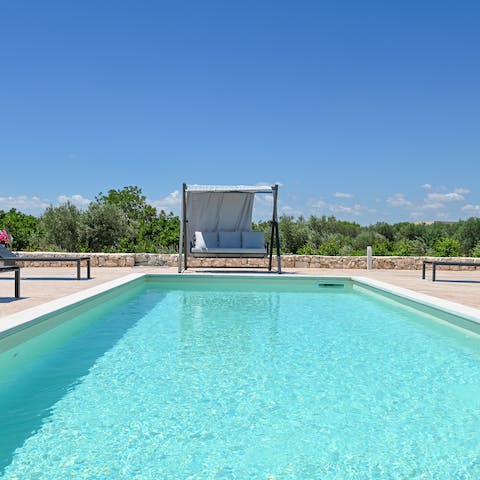 Stay cool in your private swimming pool – there are swing seats to recline in, too