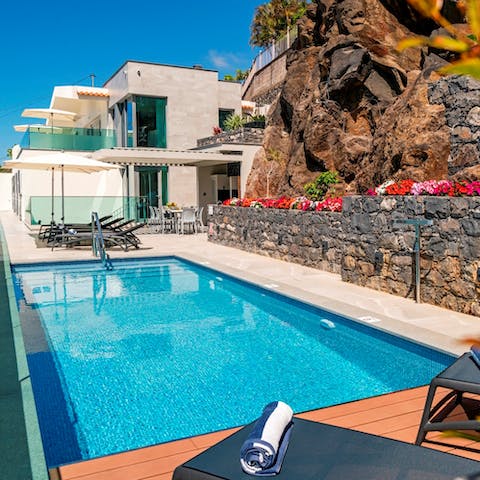 Sip a refreshing Madeira wine cocktail by the pool