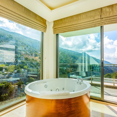 Soak into the hot tub while admiring the views